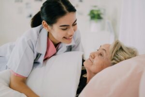 Senior patient with home care nurse, Happy senior woman talking with caregiver