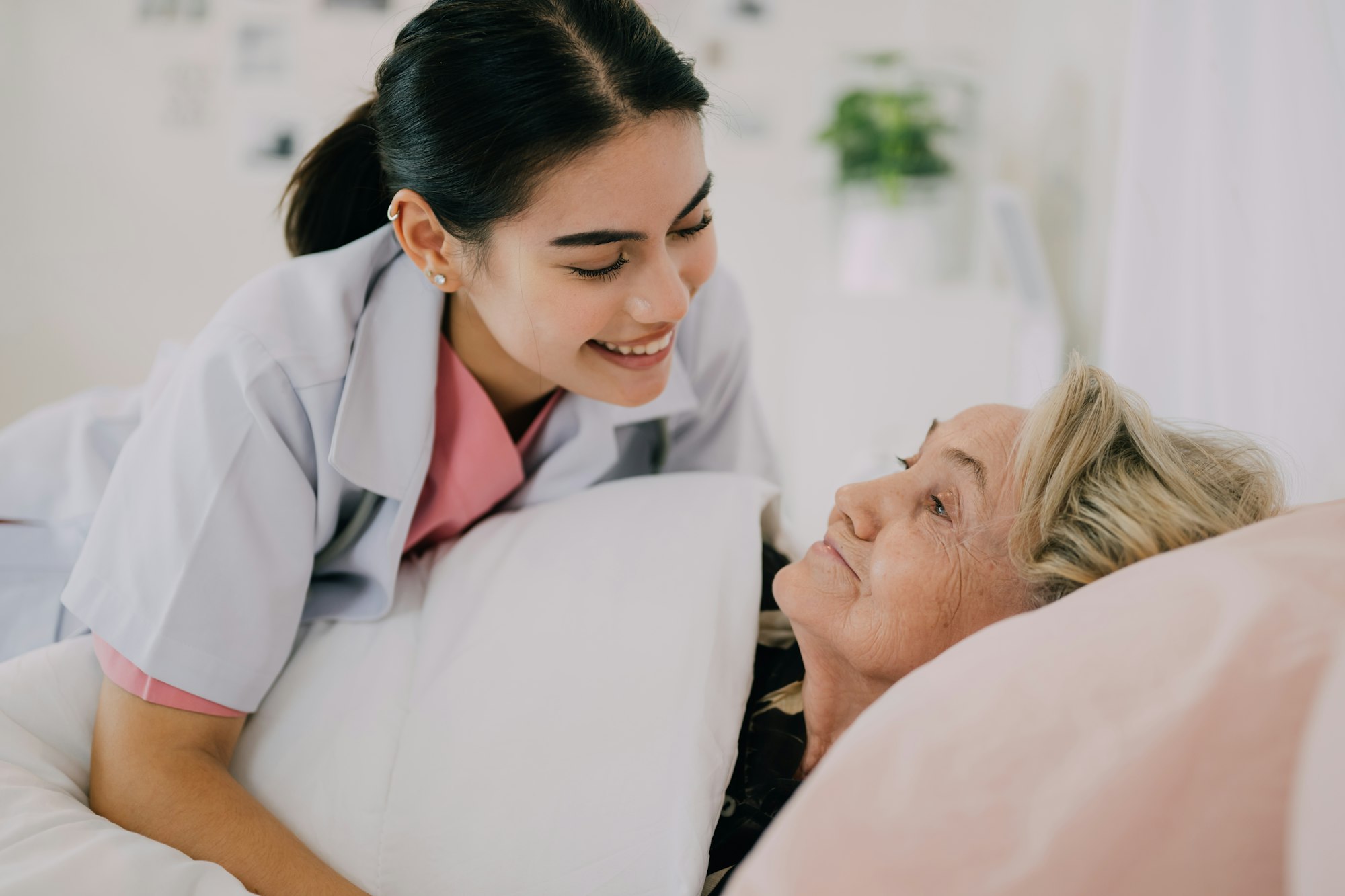 Senior patient with home care nurse, Happy senior woman talking with caregiver